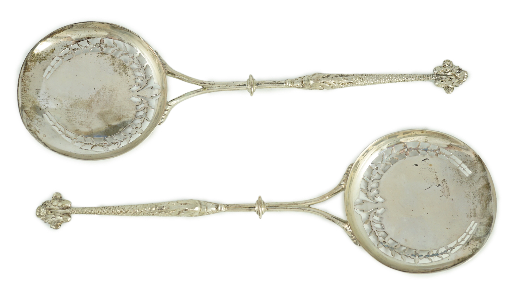 A pair of George V Asprey & Co pierced silver serving spoons